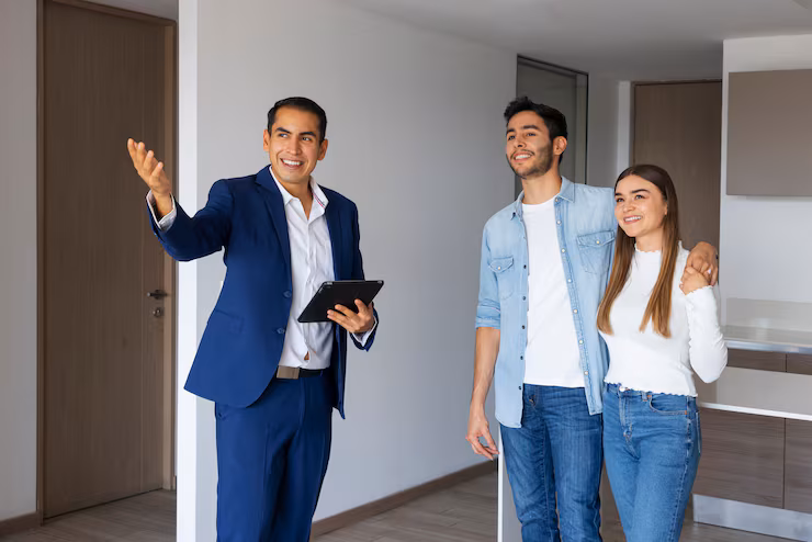 Couple talking with real estate agent