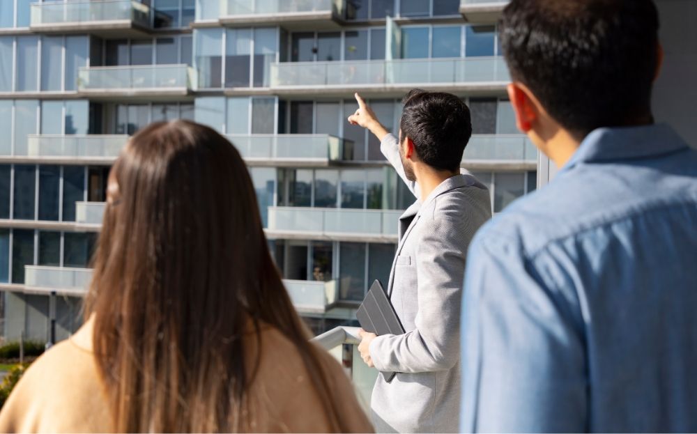 Commercial real estate agent showing available units to his clients
