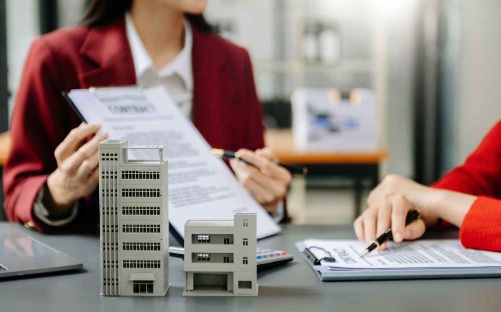 A commercial real estate agent is talking to her client.