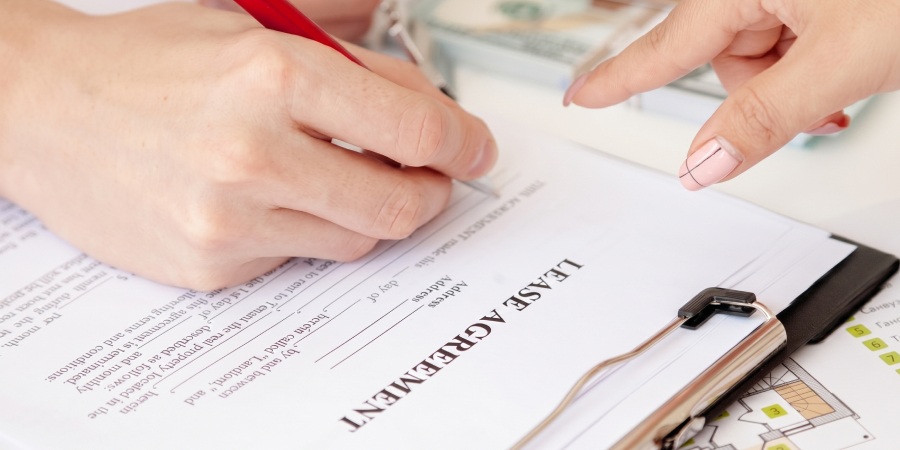 Signing a lease agreement form