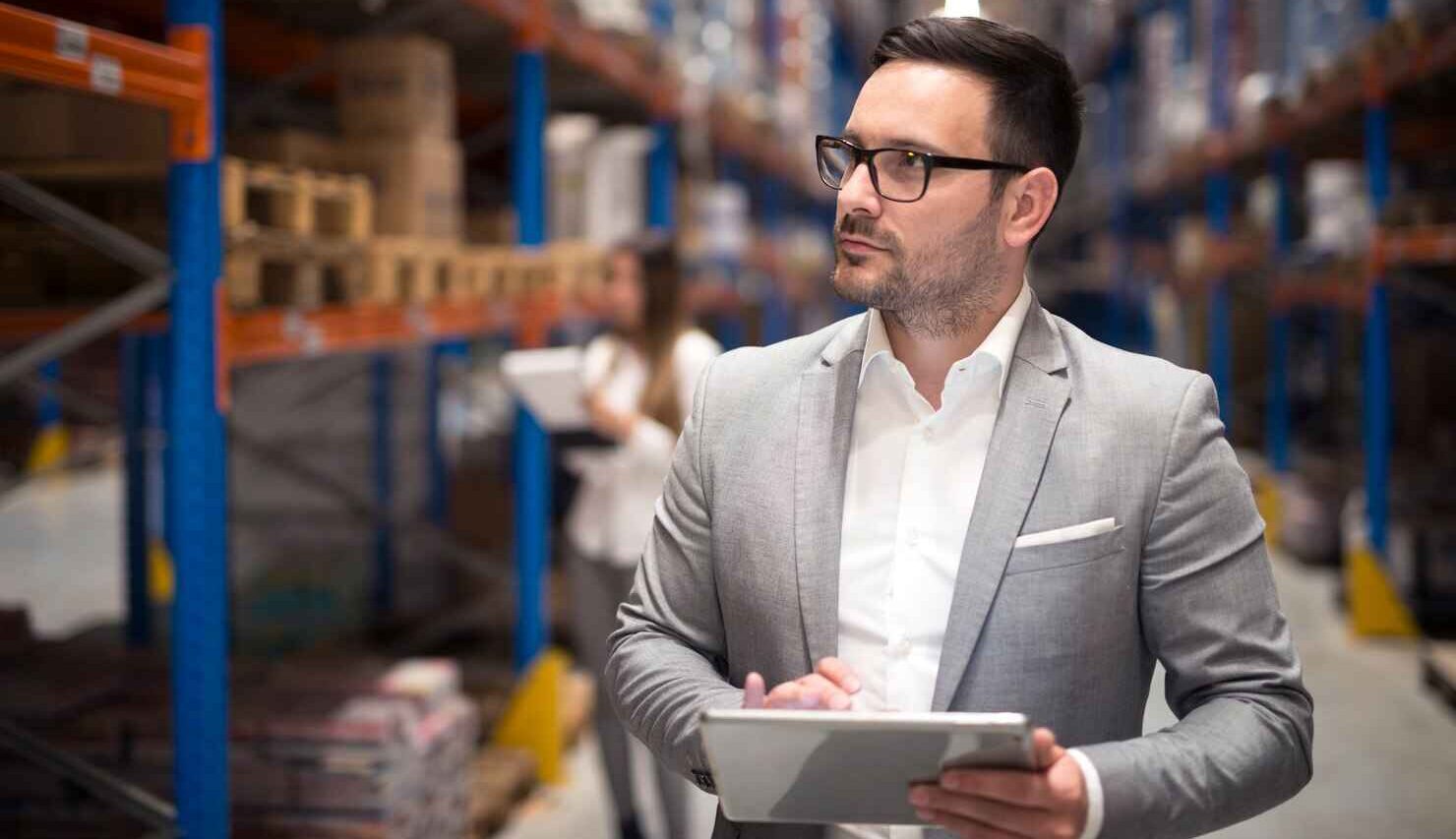 Business owner touring warehouse